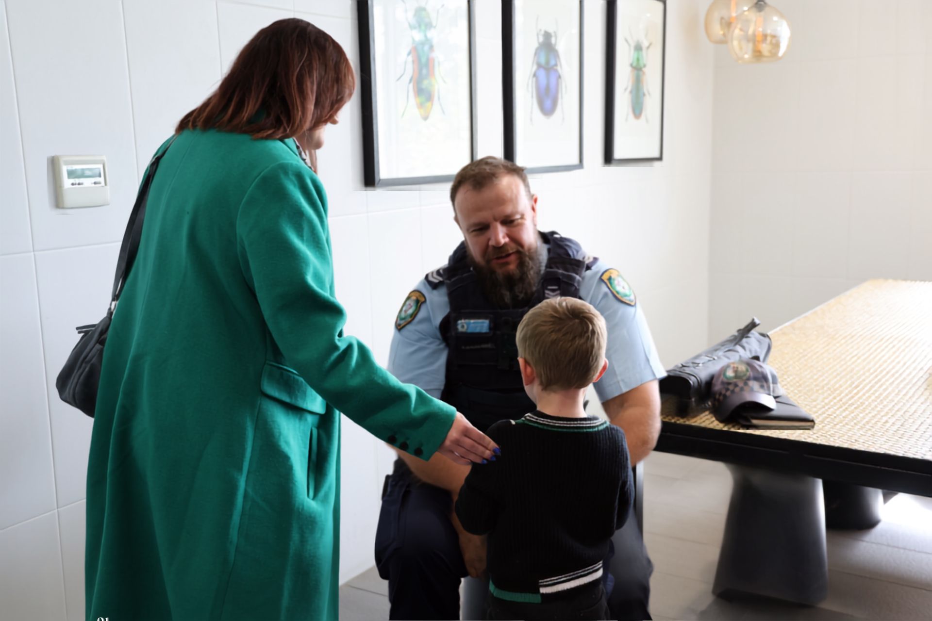 Police Officer speaking to young boy