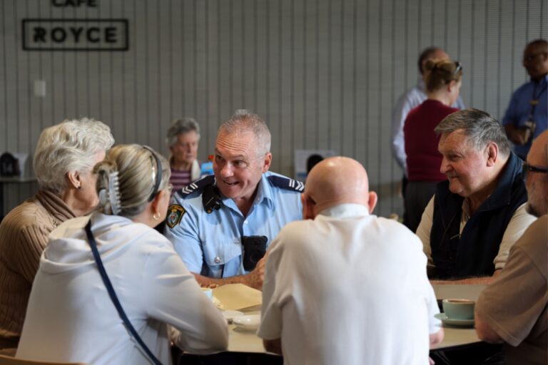 Police Officer talking to local residents